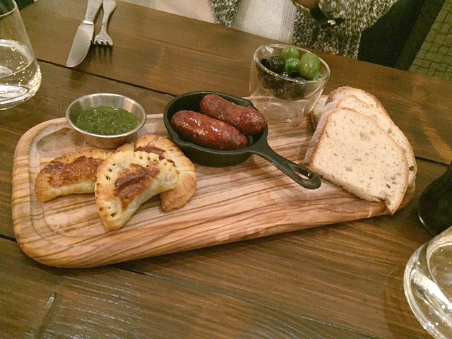 starter of bread, olives, pasties and sausages