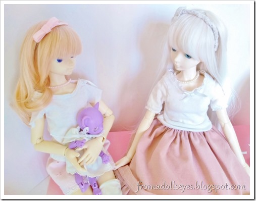 The kitty doll is sitting in Usagi's lap and staring at Hikaru and her skirt.  Hikaru is commenting on the cat.