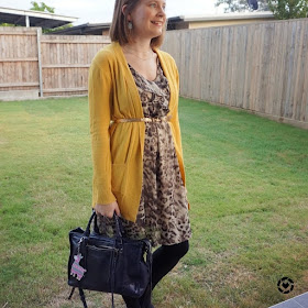awayfromblue Instagram | witner office otufit belted mustard yellow cardigan with animal print ruffle dress regan bag