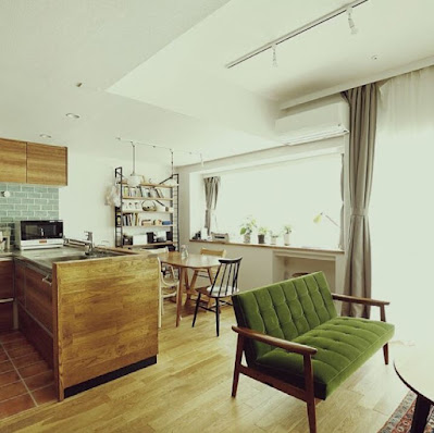 Nice apartment decoration with wooden furniture in dining area and mid century sofa in living room