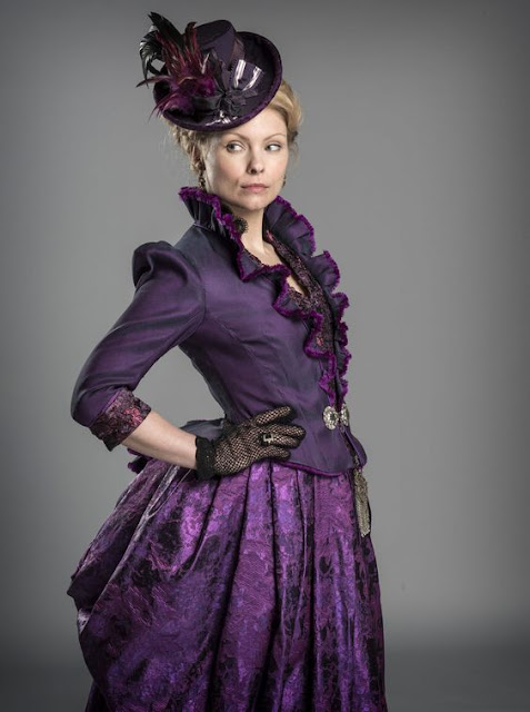 Women's Victorian costume. Purple dress/skirt with fitted jacket, hat, fishnet gloves. Women's Steampunk clothing.