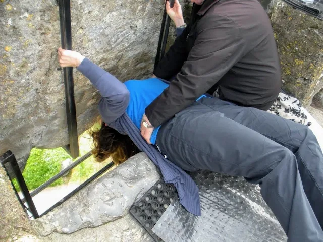 Kissing the Blarney Stone at Blarney Castle in Cork