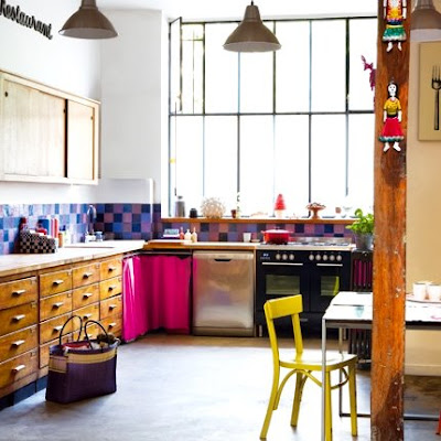 the unexpected bright colors in this kitchen