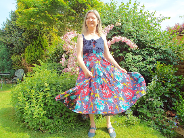 Pretty floaty dress from JD Williams website modelled in a green and leafy garden