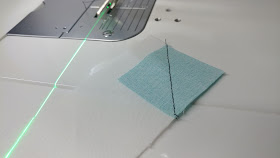 Sewing stitch-n-flip corners with a sewing machine laser