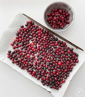 How to make a simple cranberry garland with faux sugar dipped berries for inexpensive holiday decor with nostalgic old fashioned Christmas charm for a fireplace mantel or Christmas tree.