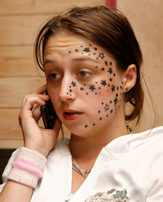 Star Tattoo Designs Young European celebrity girl with small black stars 