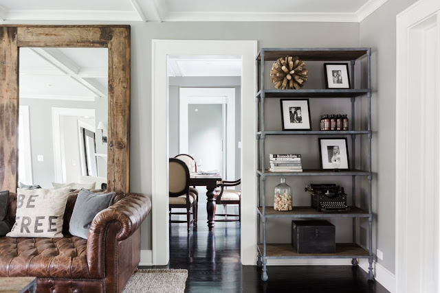 Modern farmhouse living room with leather tufted sofa on Hello Lovely Studio