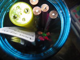 Nesting school supplies into water bottle in an OCC shoebox.