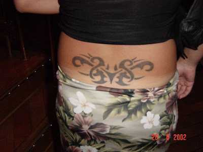Lovely black tribal lower back tattoo.