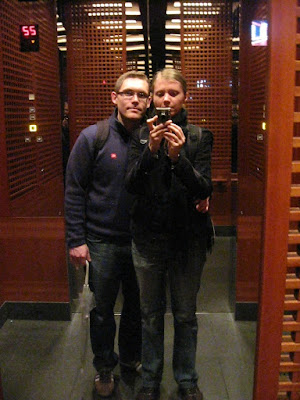 K & J in the elevator up to the top