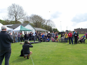 Throwing a currant bun at the World Bun Throwing Championships at Abingdon Vale Cricket Club