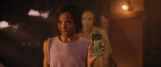 We Have A Ghost. (L to R) Erica Ash as Melanie, David Harbour as Ernest in We Have A Ghost. Courtesy of Netflix © 2022.
