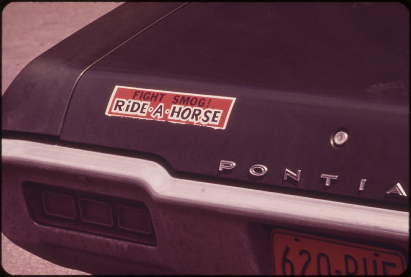 Sound Advice on a Car Parked in a Lot on West Street, near the Newly Constructed World Trade Center 05/1973