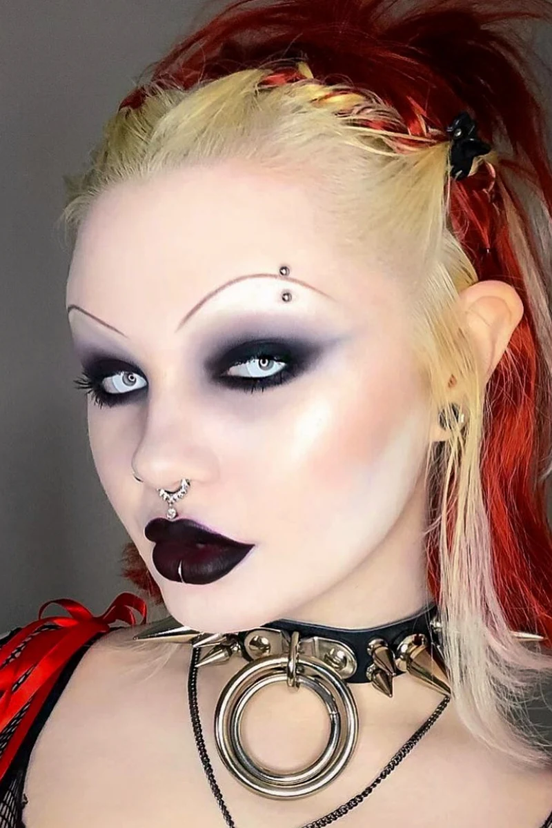 close-up portrait of a beautiful young woman with a pretty goth makeup look