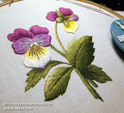 Completed thread painted violas. Photo taken at an agle showing the main leaf in 3-D