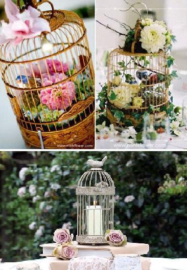 How enchanting are these bird cage centerpieces holding flowers candles 