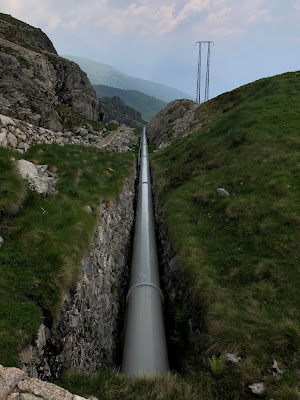 Scenes from the trail with the ever-present water pipe bringing water from two of the alpine lakes down to the Valgoglio hydroelectric plant in the valley.