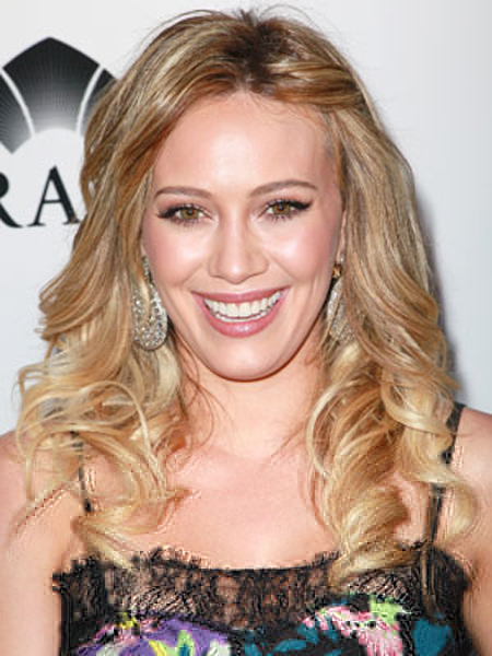 Hilary Duff nails it with this perfect spring look: Blonde bouncy curls, a pinned-back side and a floral top