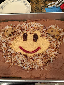 Monkey Face Birthday Cake using toasted coconut, chips ahoy cookies, crushed graham crackers, licorice, and dates for the eyes