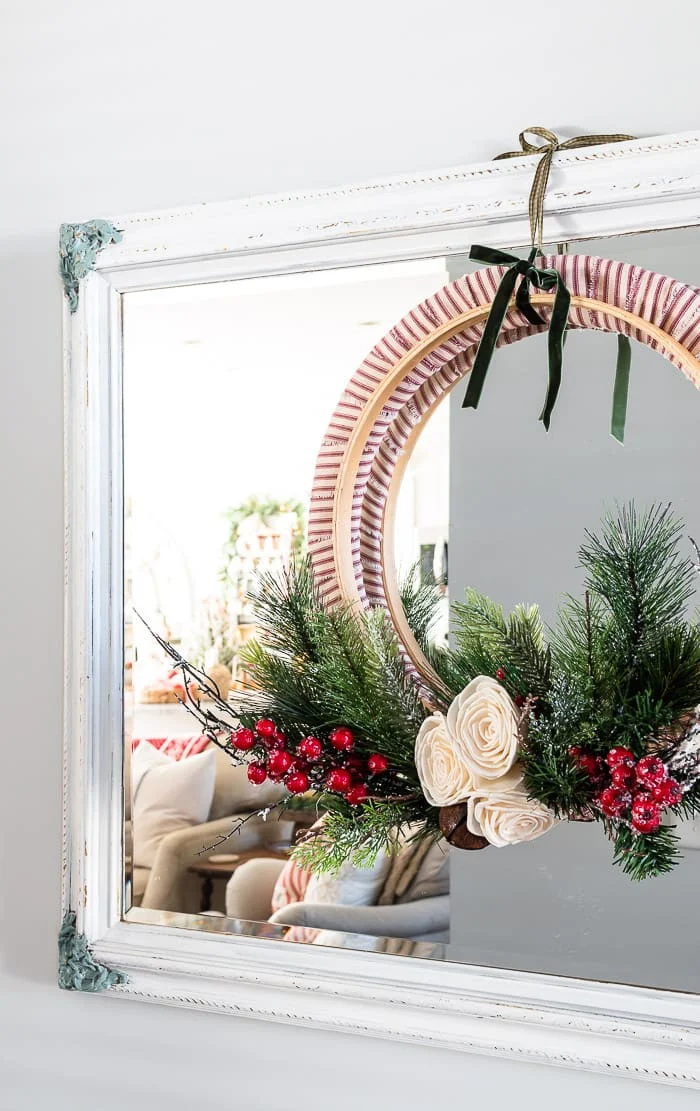 Christmas wreath hanging on mirror
