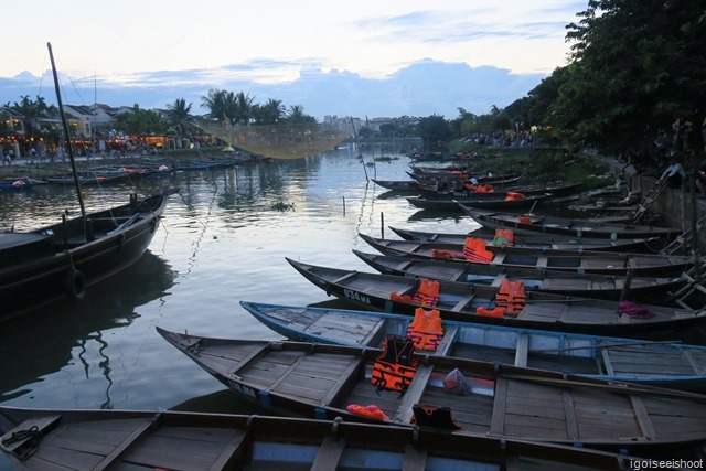 Hoi An - View of the river and the wooden boats in the evening