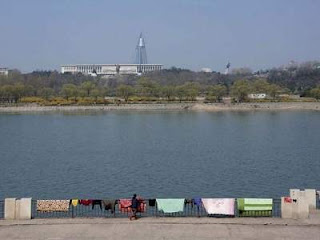 drying carpets on the banks of the Taedong River