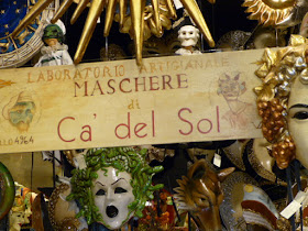 At the front door of Ca del Sole, one of Venice's most famous mask shops