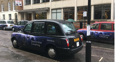 Cryptocurrency advertisements using Taxis on the streets of London