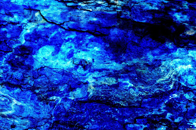 Blended photographs combine to create an abstract in a variety of blue colors. © Evan's Studio, 2018.