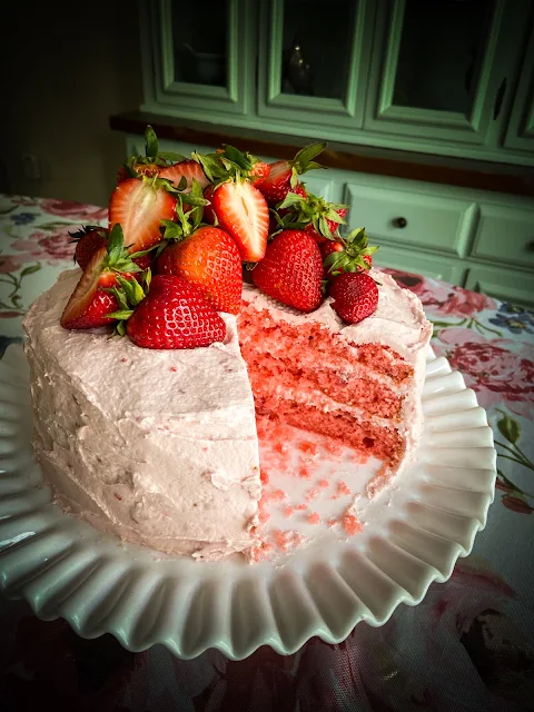 Fresh Strawberry Cake with Strawberry Buttercream Frosting, the ultimate Southern dessert for any special occasion, or just for a delightful dinner with family.  Fresh juicy strawberries take center stage in this show-stopping strawberry cake and buttercream frosting.