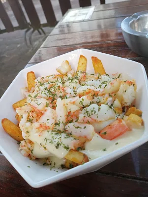 "Loaded cheese shrimp fries from Tori Oso Paramaribo"