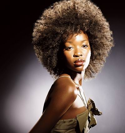 2002 afro ponytail hairstyle. Long black hair was pulled into a ponytail,