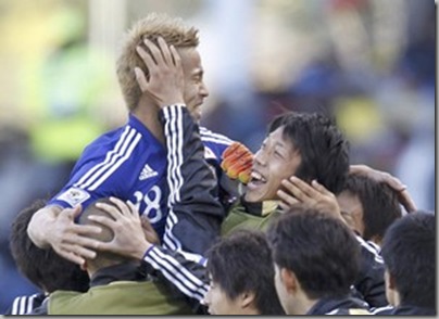 Japan's Keisuke Honda celebrates Winning