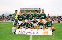 NOVELDA C. F. - Novelda, Alicante, España - Temporada 2002-03 - Rubén, Juanjo, Benito, Madrigal, Puche, Gustavo; Mullor, Carlos Pollo, Carrasco, Jorge y Cudi - NOVELDA C. F. 3 (Madrigal 3), F. C. BARCELONA 2 (Geovanni y Riquelme) - 11/09/2002 - Copa del Rey, 3ª eliminatoria - Novelda (Alicante), campo de la Magdalena - El Novelda, que entonces militaba en 2ª B, da la campanada y elimina al Barsa de la Copa