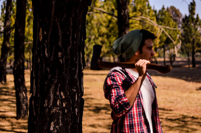 Lumberjack walking with axe