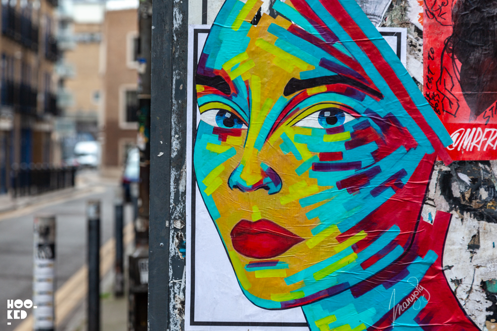 French Street Artist Manyoly colourful female portrait  pasteups