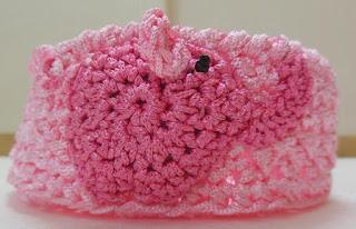 Sweet Nothings Crochet free crochet pattern blog, photo of the first pink small nesting basket with a pink elephant motif on one side