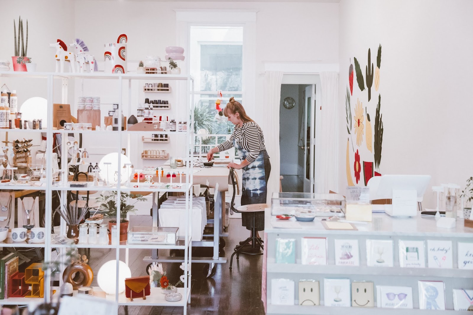 Jenny Lemons in San Francisco Mission District, inside store, artist at work, shelves of items, arizonagirl.com