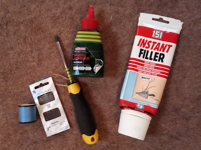 Photo of needle & thread, screwdriver, wood glue and polyfilla