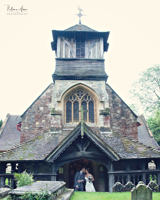 bride and groom on front of St Leonards in Bursledon