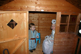 Top Ender dressed as an Angel with Baby Boy dressed as a shepherd having invited the Angel into the inn