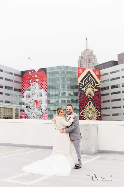 bride and groom overlooking Detroit city skyline on z belt lot 