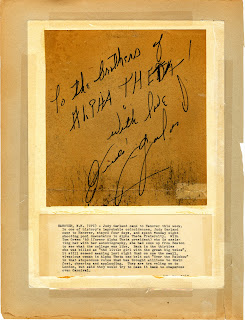 A note and signature from Judy Garland, with a typed explanation taped beneath it.