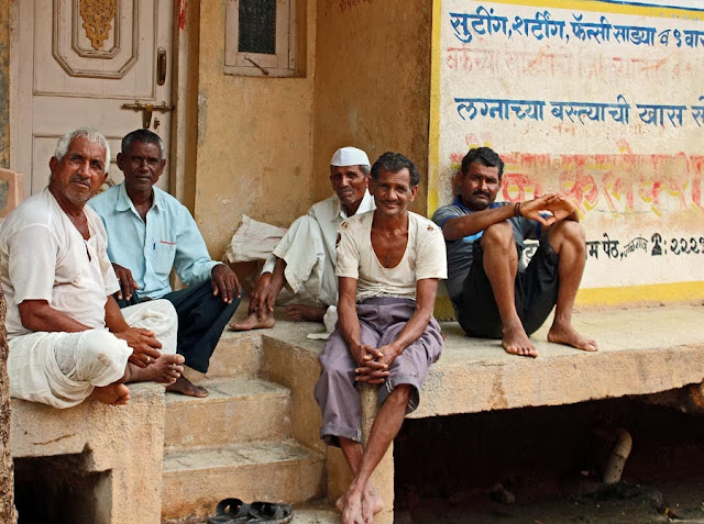 group of old and elderly village men chatting