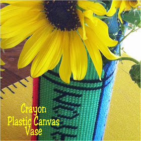 Go back to school in style with this easy crayon box plastic canvas vase.  This free pattern can be stitched up by even the beginner and decorate your home or classroom.  #backtoschool #vase #plasticcanvas #pattern #crayon #diypartymomblog