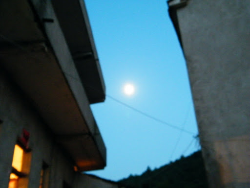 early full moon and light house.