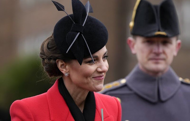 Kate Middleton wore a red double-breasted wool coat by Alexander McQueen. The Princess wore a new hat by Juliette Botterill Millinery