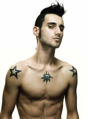 tattoos of stars for men. Handsome young male with two black framed tattoo on both shoulders.