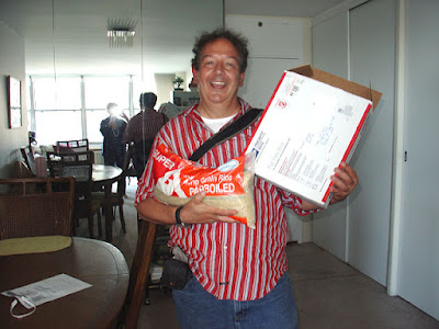 Leo with 10lbs of Parboiled Rice newly arrived from NYC.